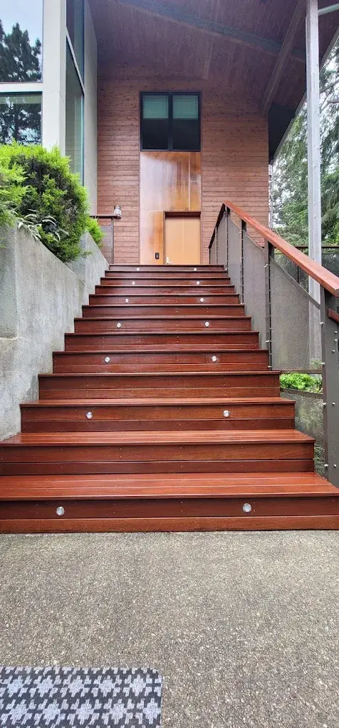 Exterior mahogany stairs with cable railing and step lighting