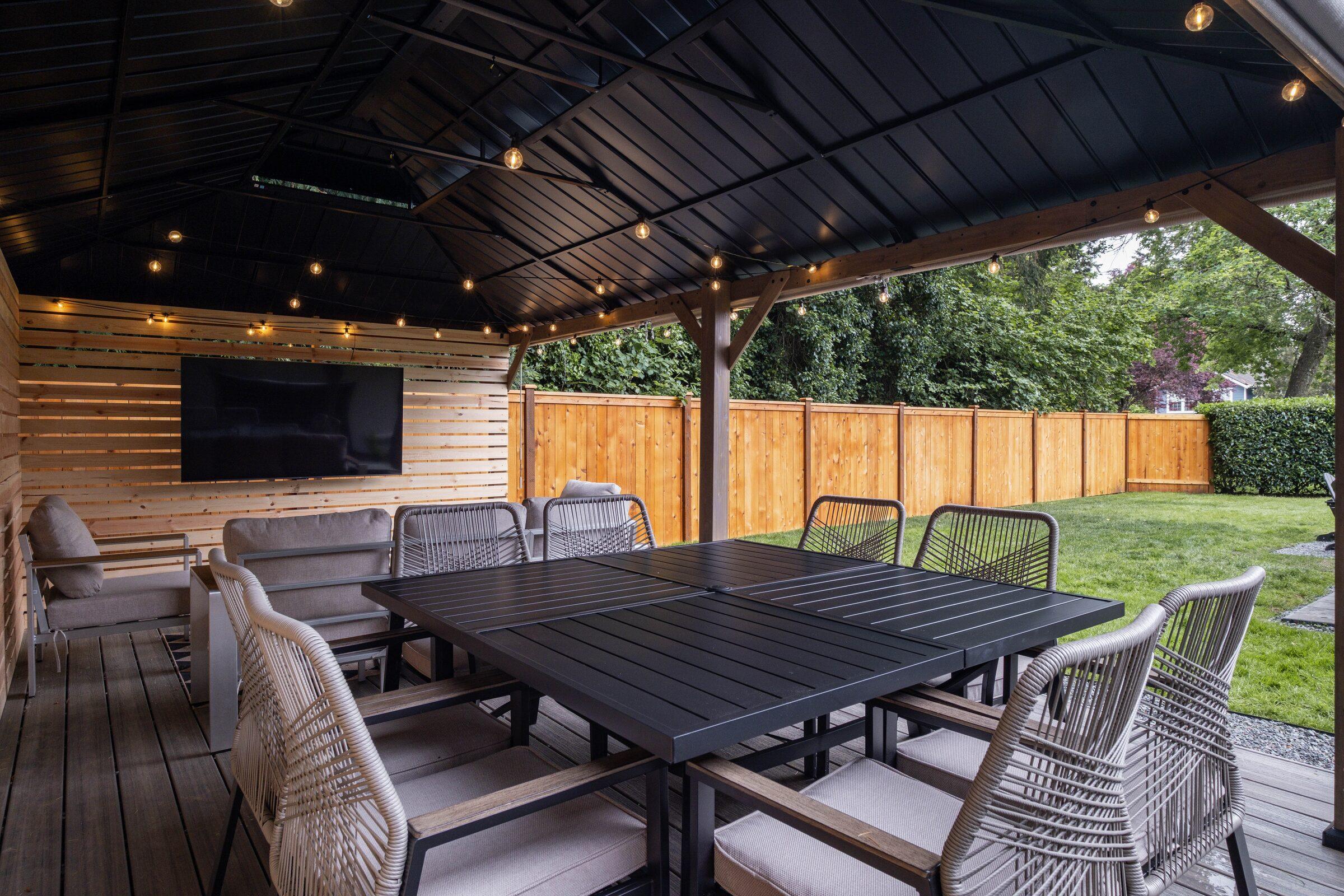 Covered outdoor patio with a dining area